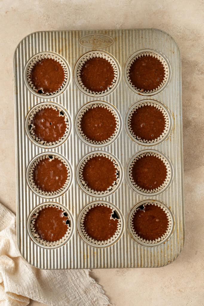 The cupcake batter in the pan ready for the oven.