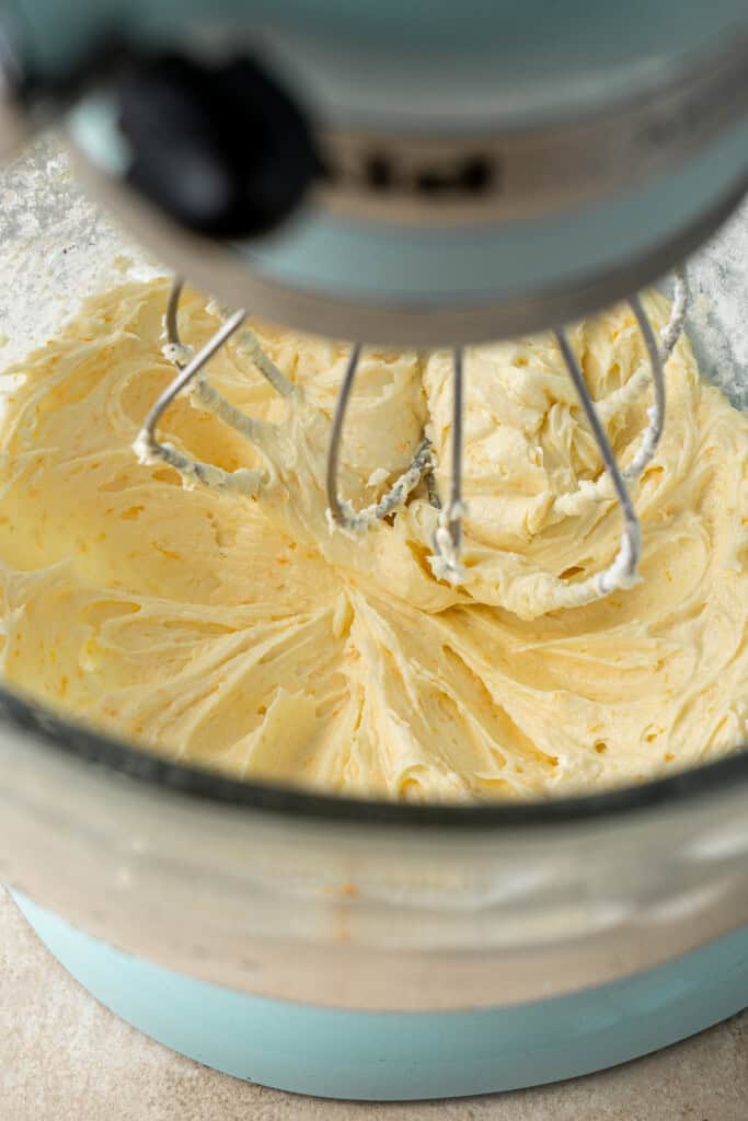 Whipping together the butter, orange zest and vanilla in a stand mixer.