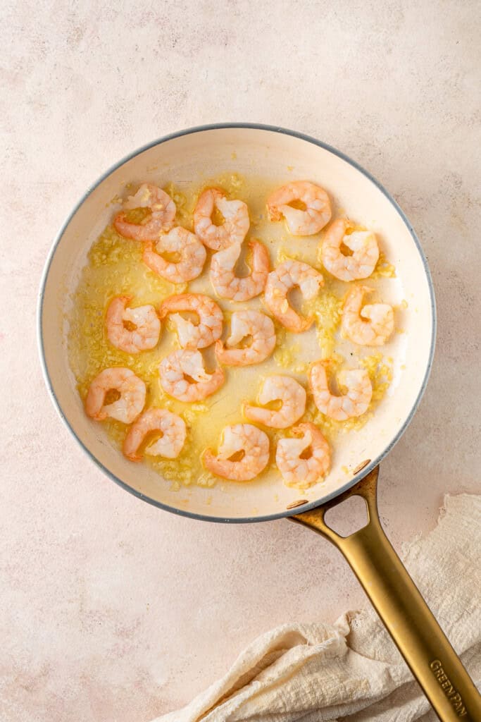 The cooked prawns in dairy free butter.