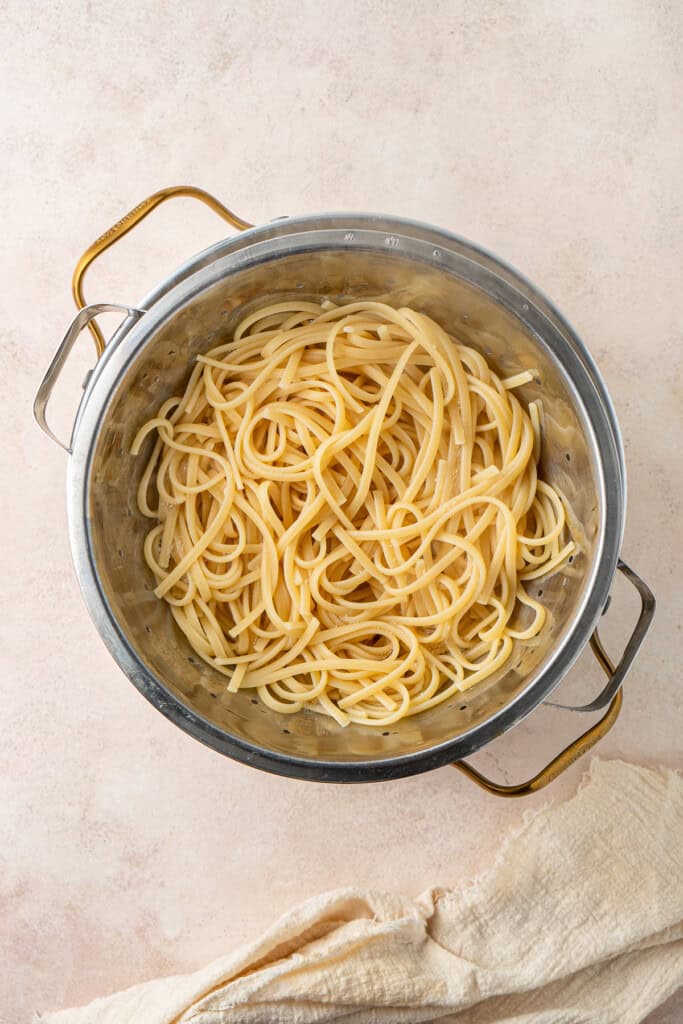 The drained cooked pasta in a pot.