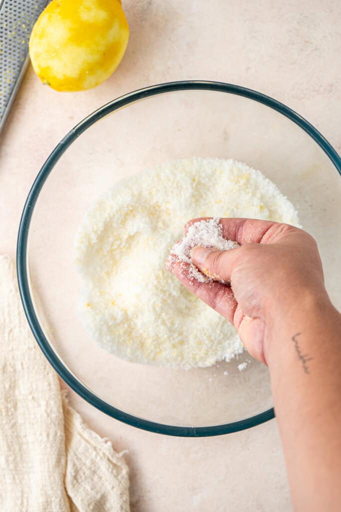 Rubbing the lemon zest into the white sugar.