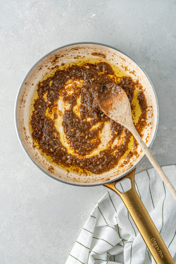 Cooking off the curry paste in the frying pan.