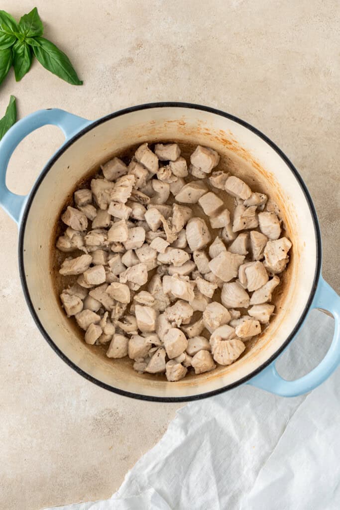 Cooking the chicken in the pot.