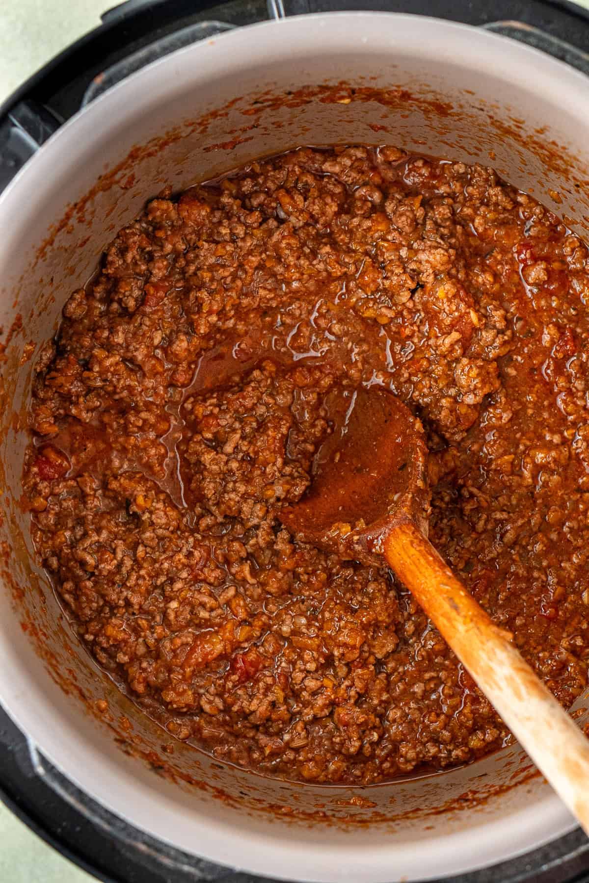 Close up of the thickened bolognese in the slow cooker.