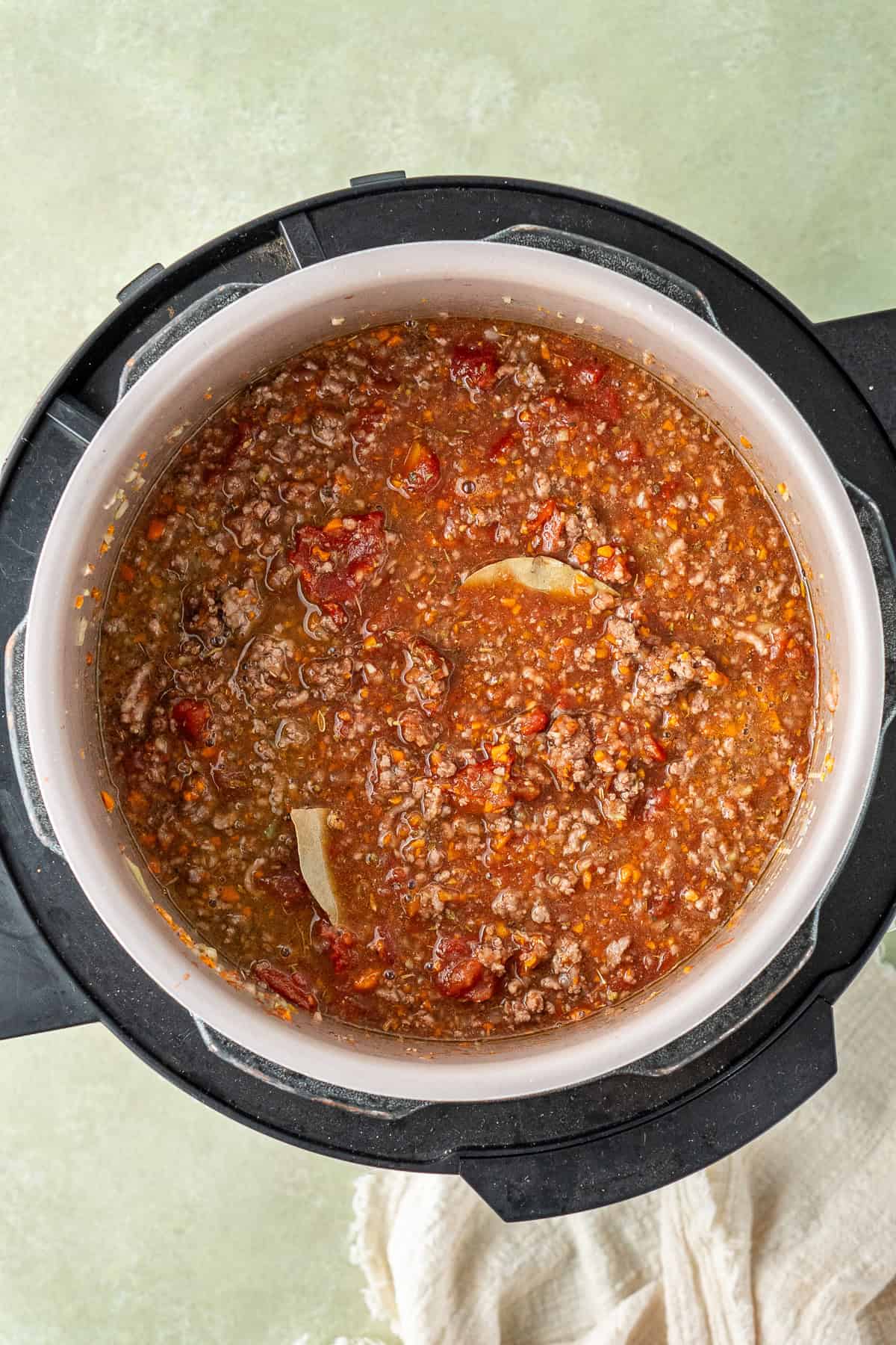 All of the ingredients in the slow cooker to make bolognese.
