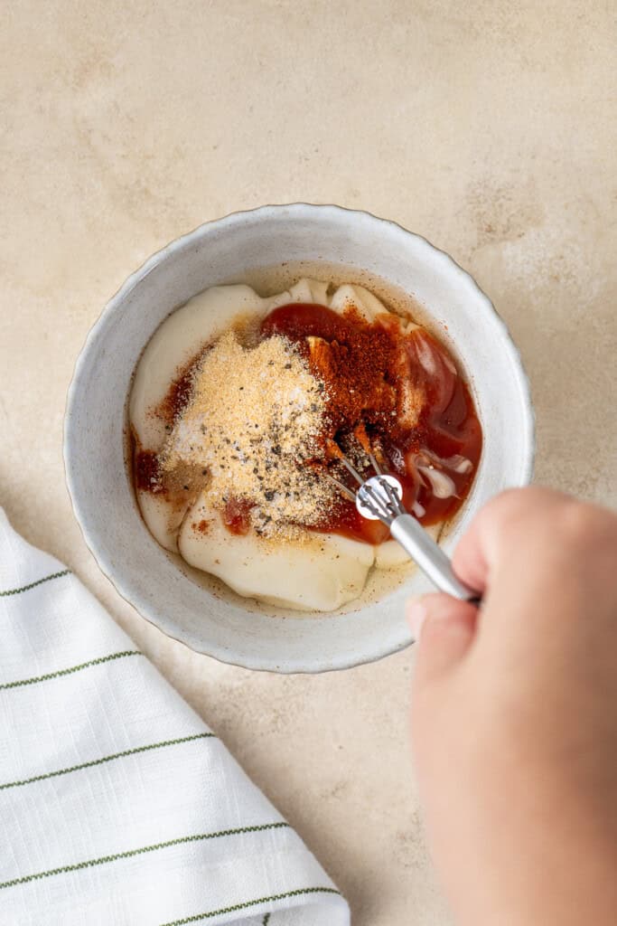 Mixing up all the sauce ingredients in a small bowl. 