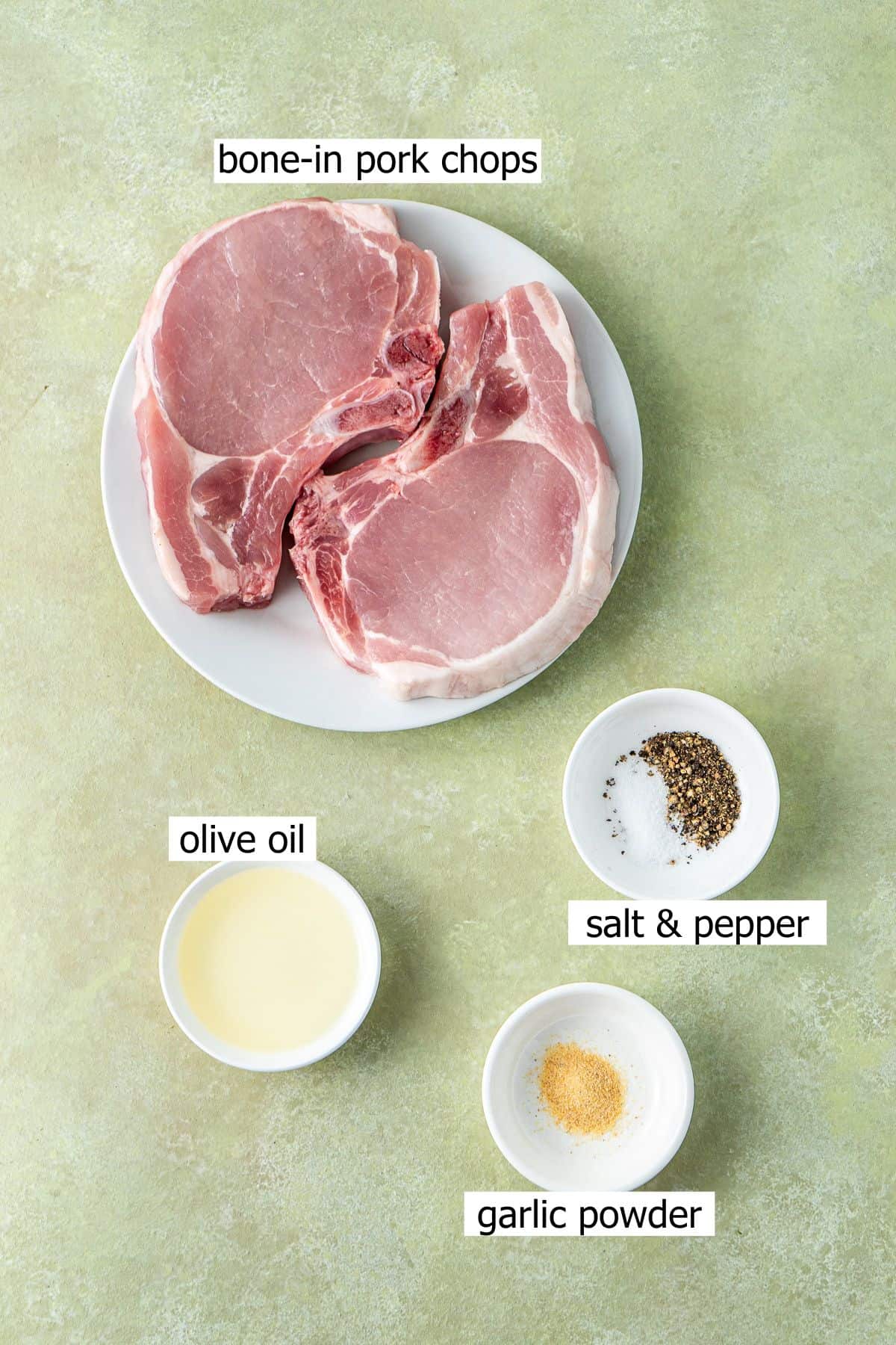 All ingredients needed to make air fryer pork chops laid out.