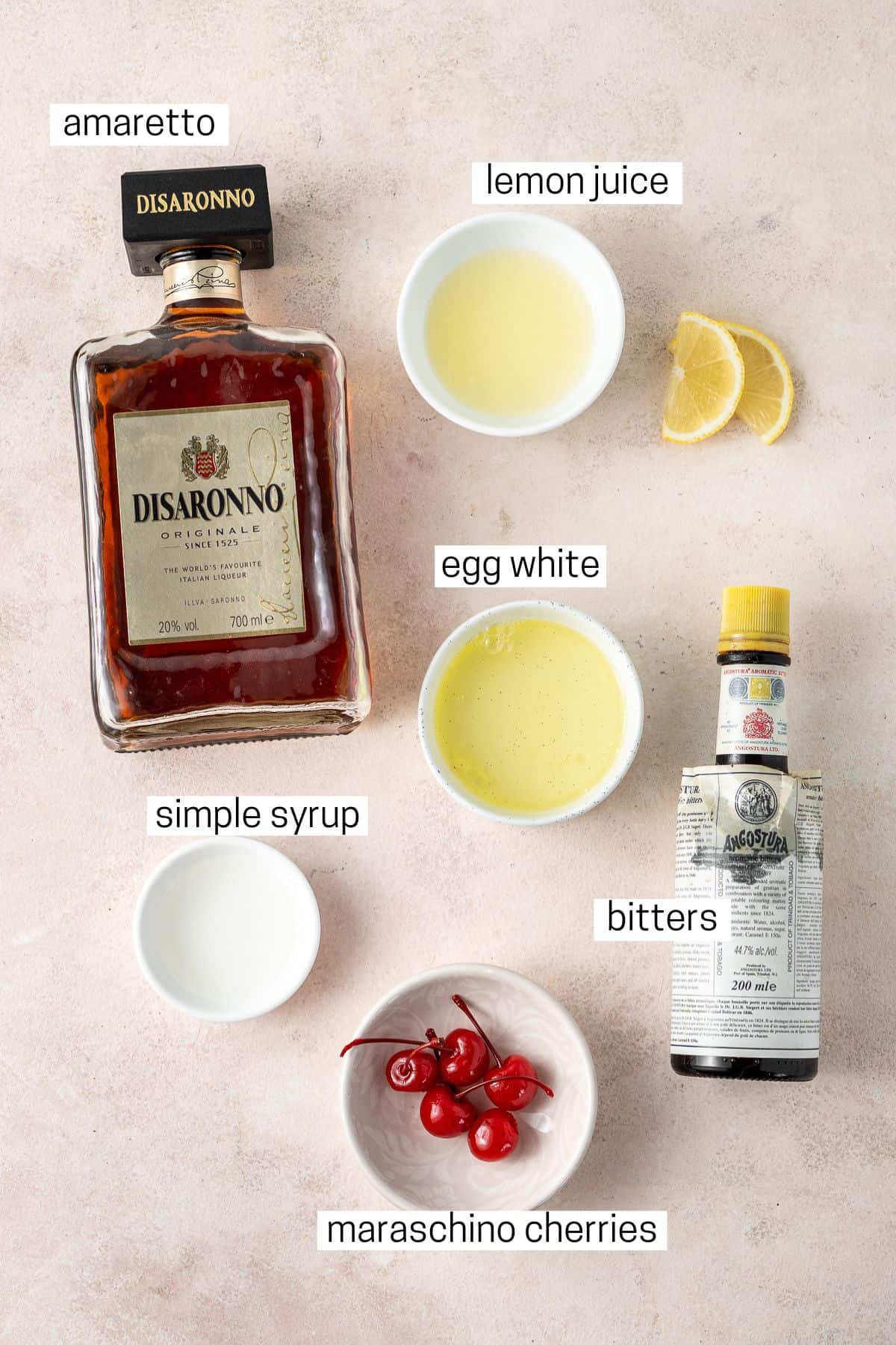 All ingredients needed to make an Amaretto Sour laid out.