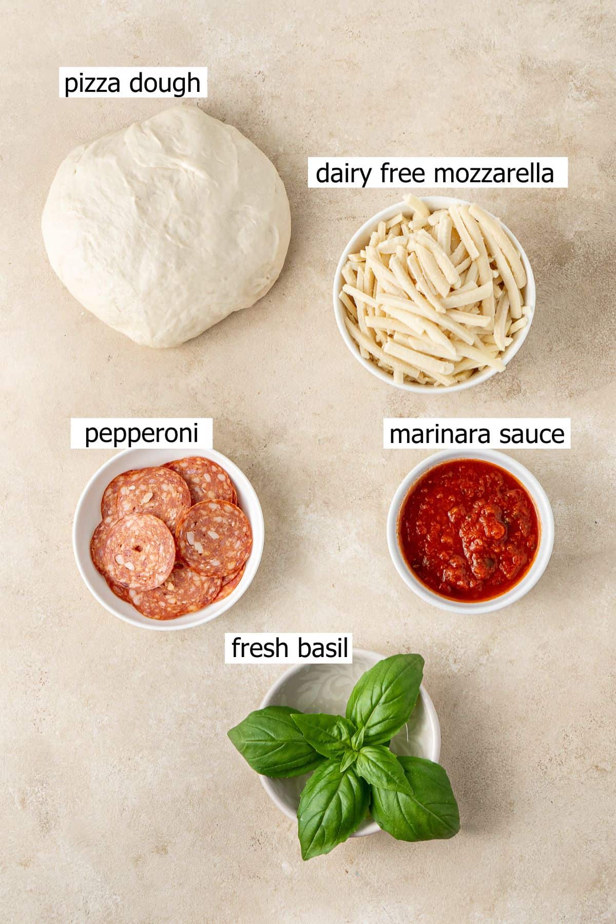 All ingredients needed to make dairy free pizza laid out.