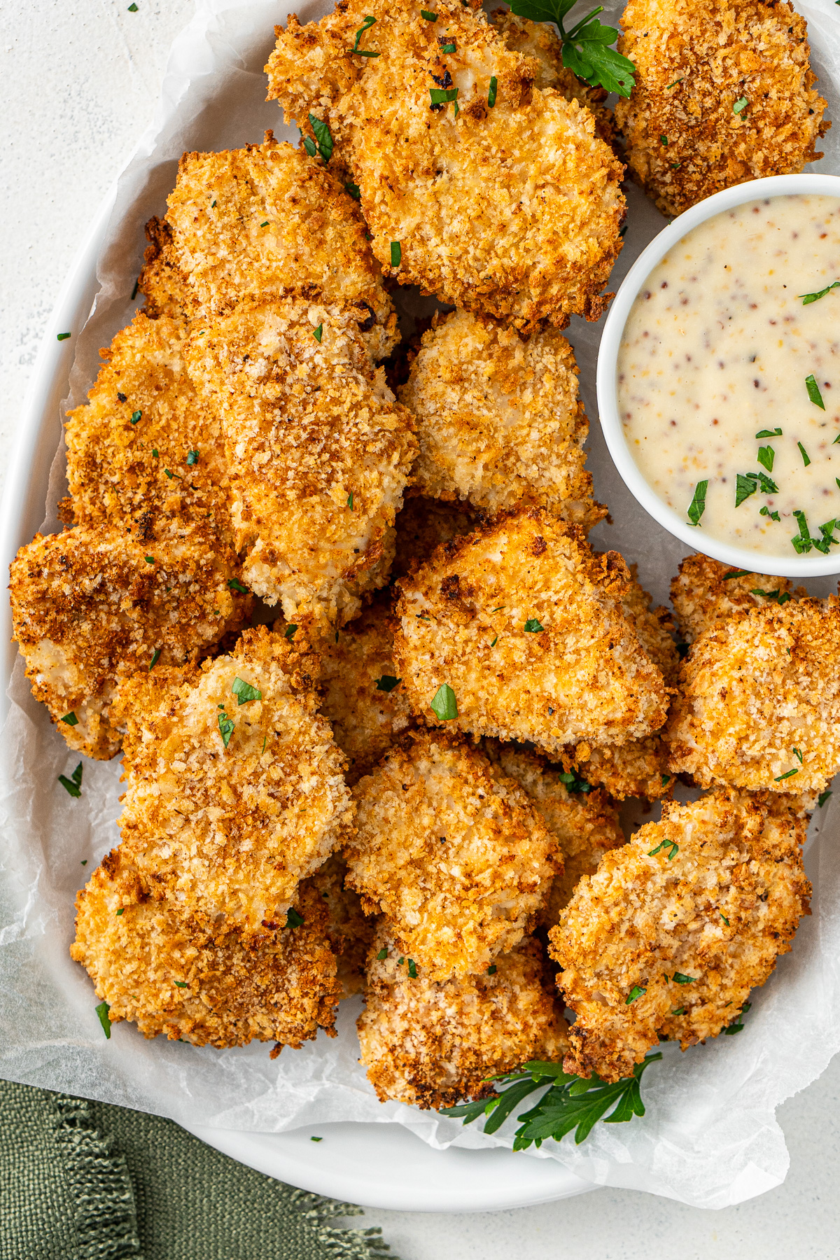 A plate of chicken nuggets with honey mustard dipping sauce.