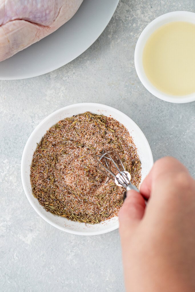 Mixing together the chicken seasoning. 