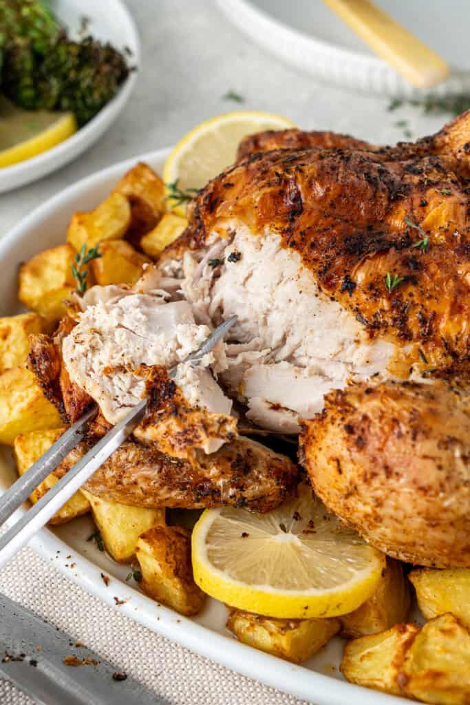 Carving the air fryer roast chicken.