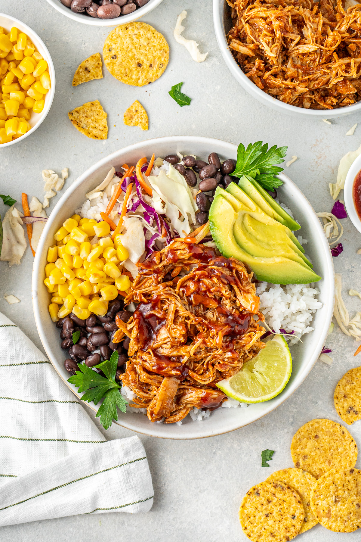 BBQ chicken bowls with all the toppings and corn chips.