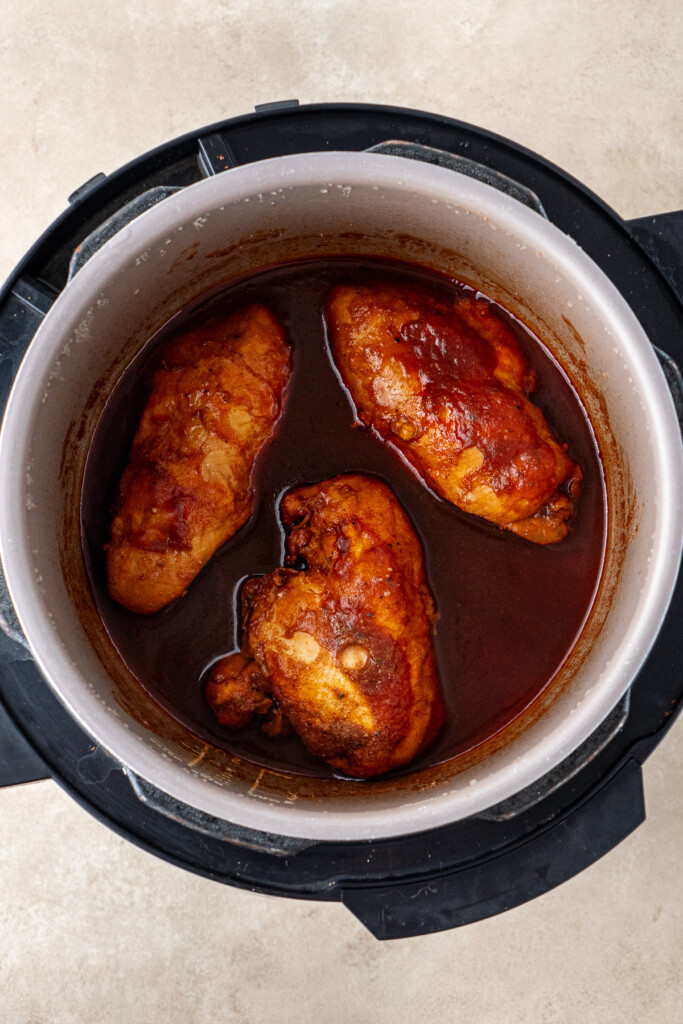 Cooked chicken in sauce in the slow cooker.