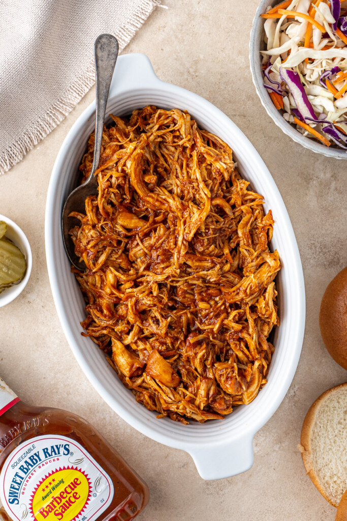 Slow cooker BBQ chicken in a bowl ready to serve.