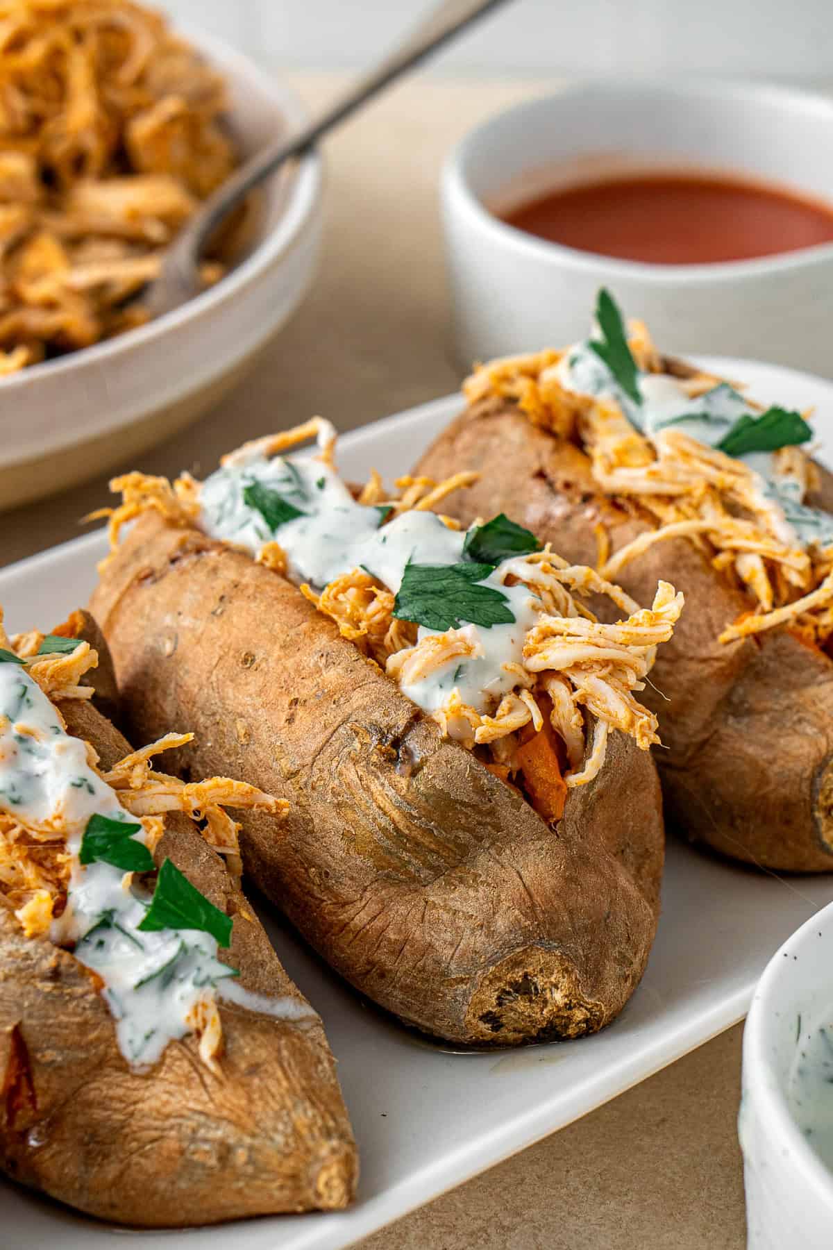 The stuffed sweet potatoes on a plate.