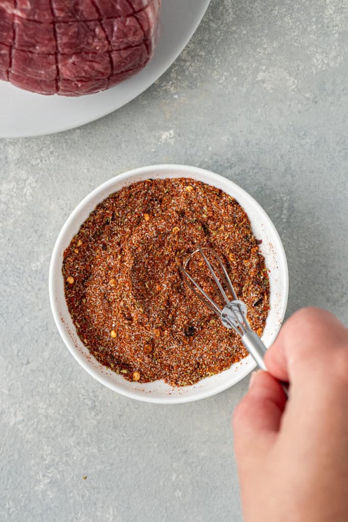 Mixing together the spices.