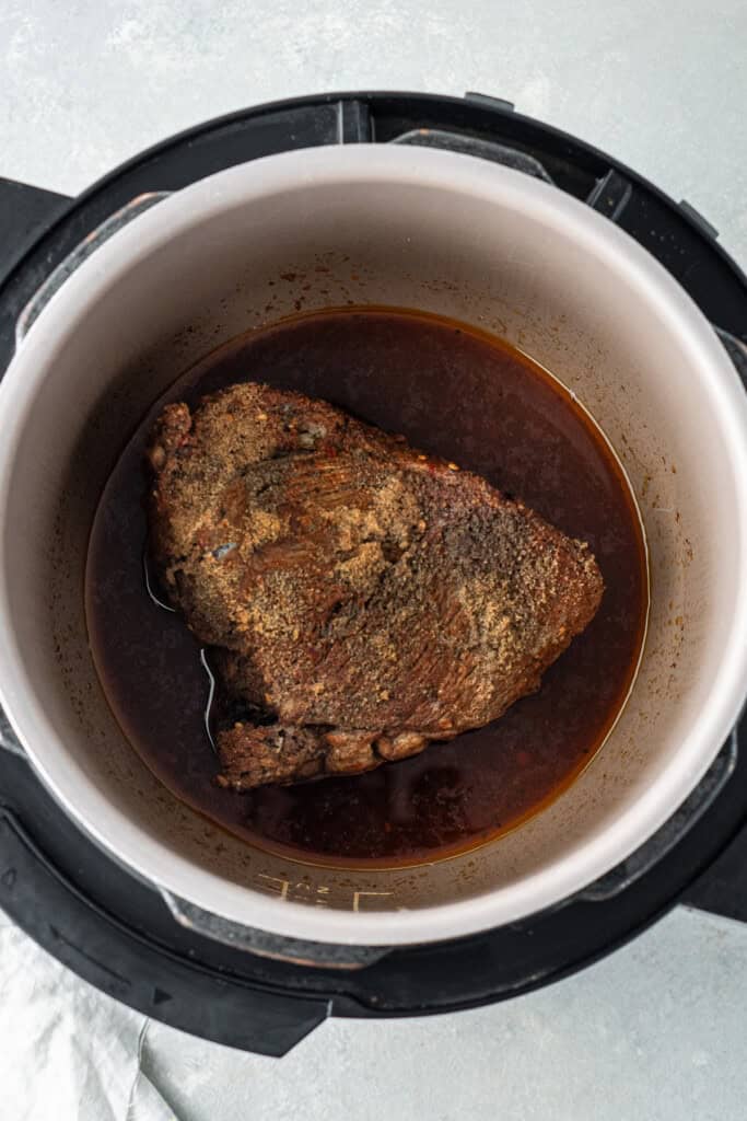 The meat in the slow cooker after 6 hours.