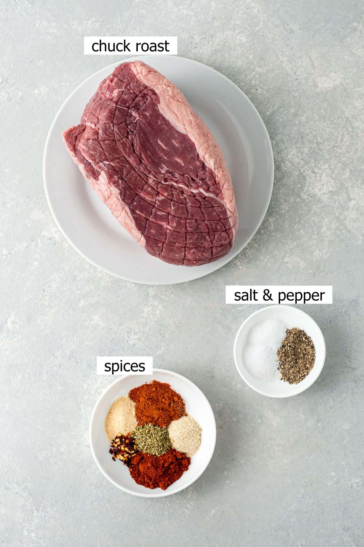 All ingredients needed to make mexican slow cooker pulled beef laid out in bowls.