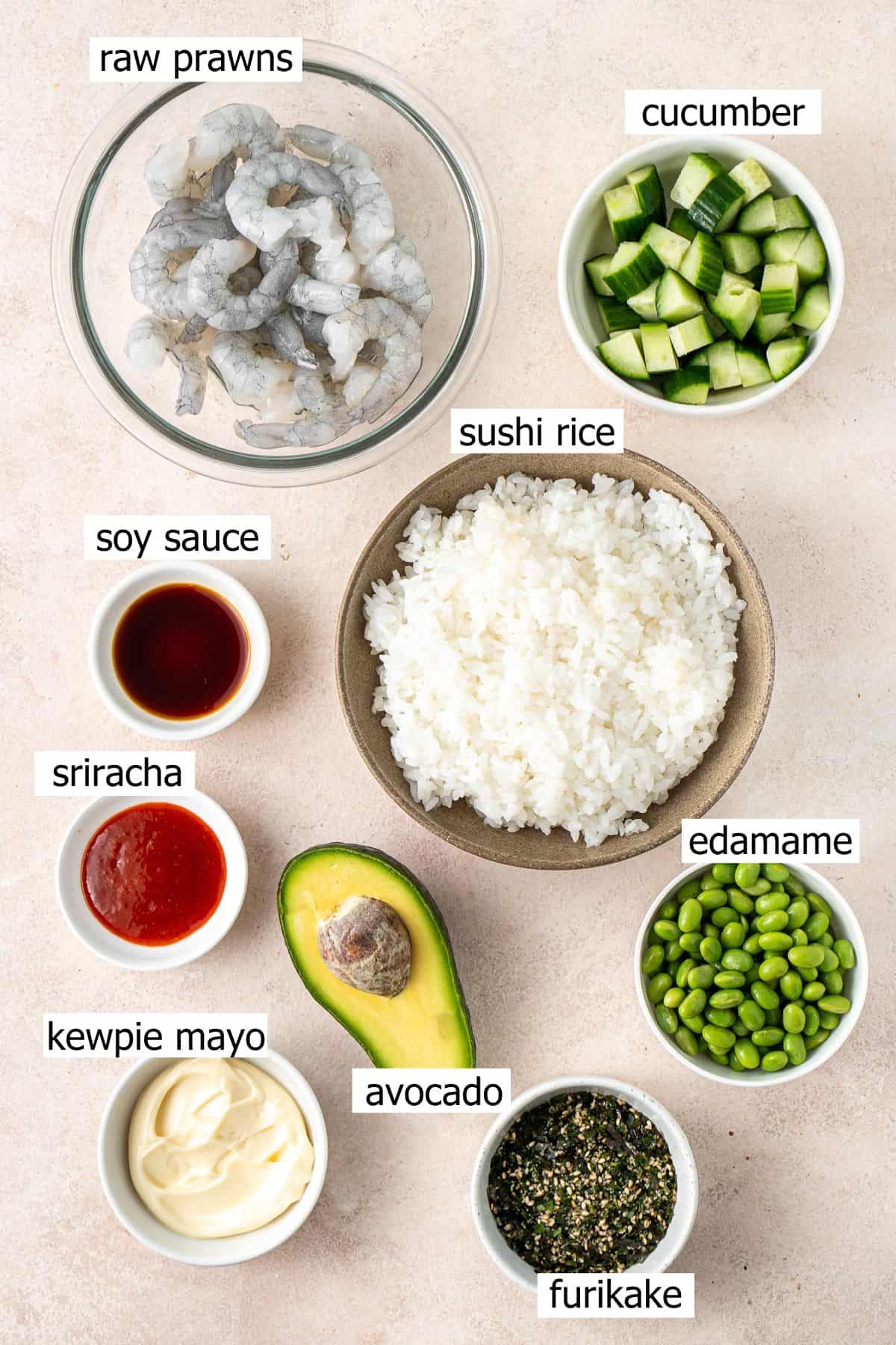 All ingredients needed to make spicy prawn and rice bowls laid out in bowls.