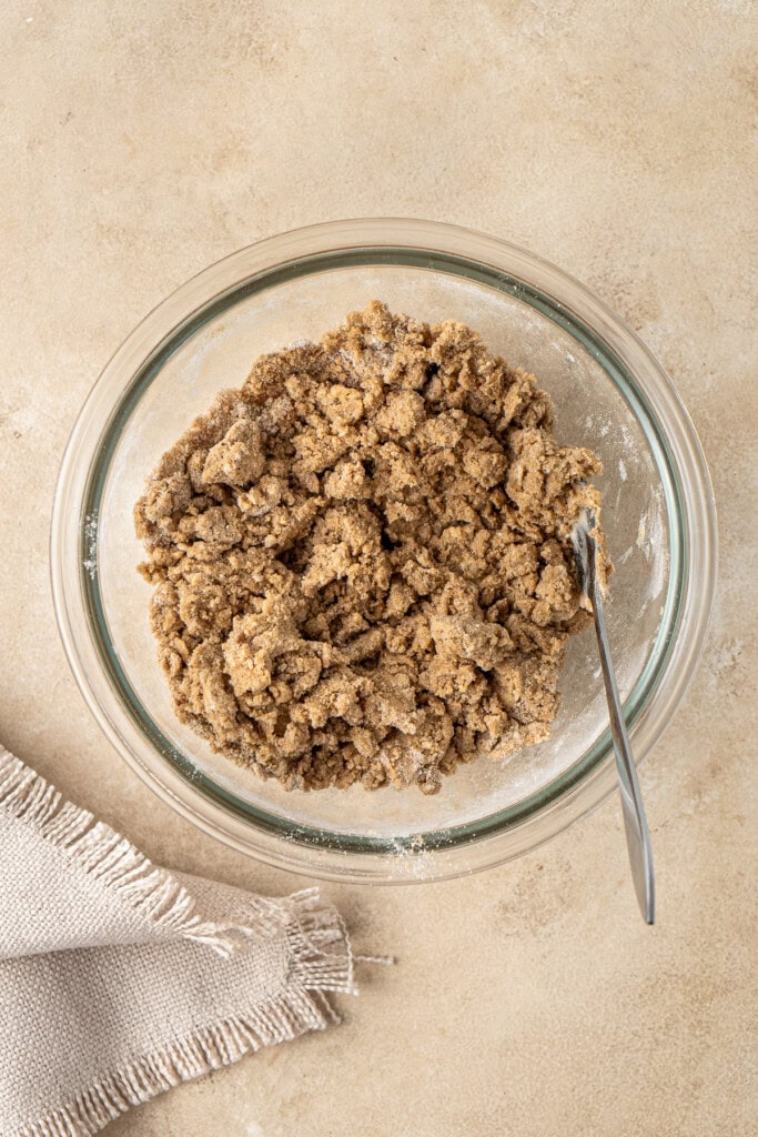 Mixing up the crumble topping in a small bowl.