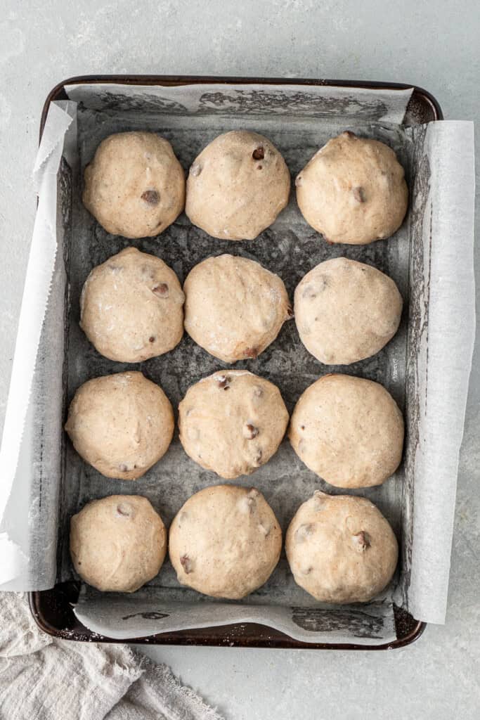 The buns in the pan before the second rise.