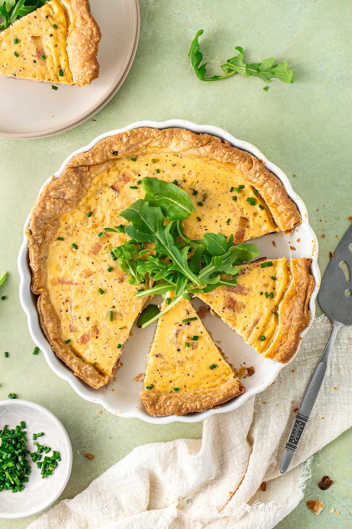 A dairy free quiche sliced into wedges. 