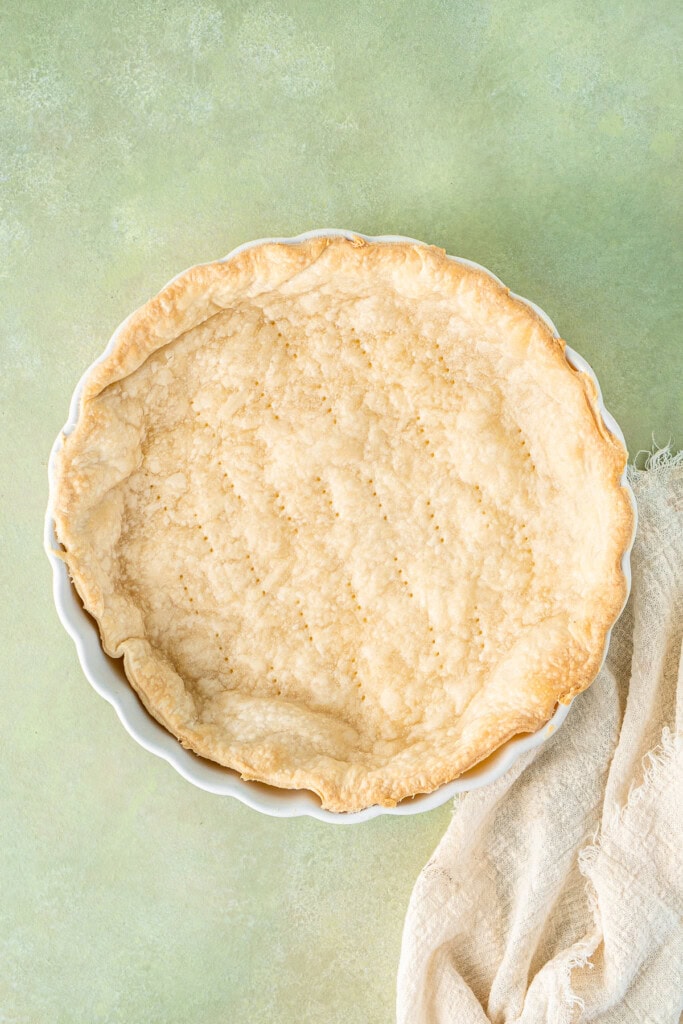 The blind baked pie crust.