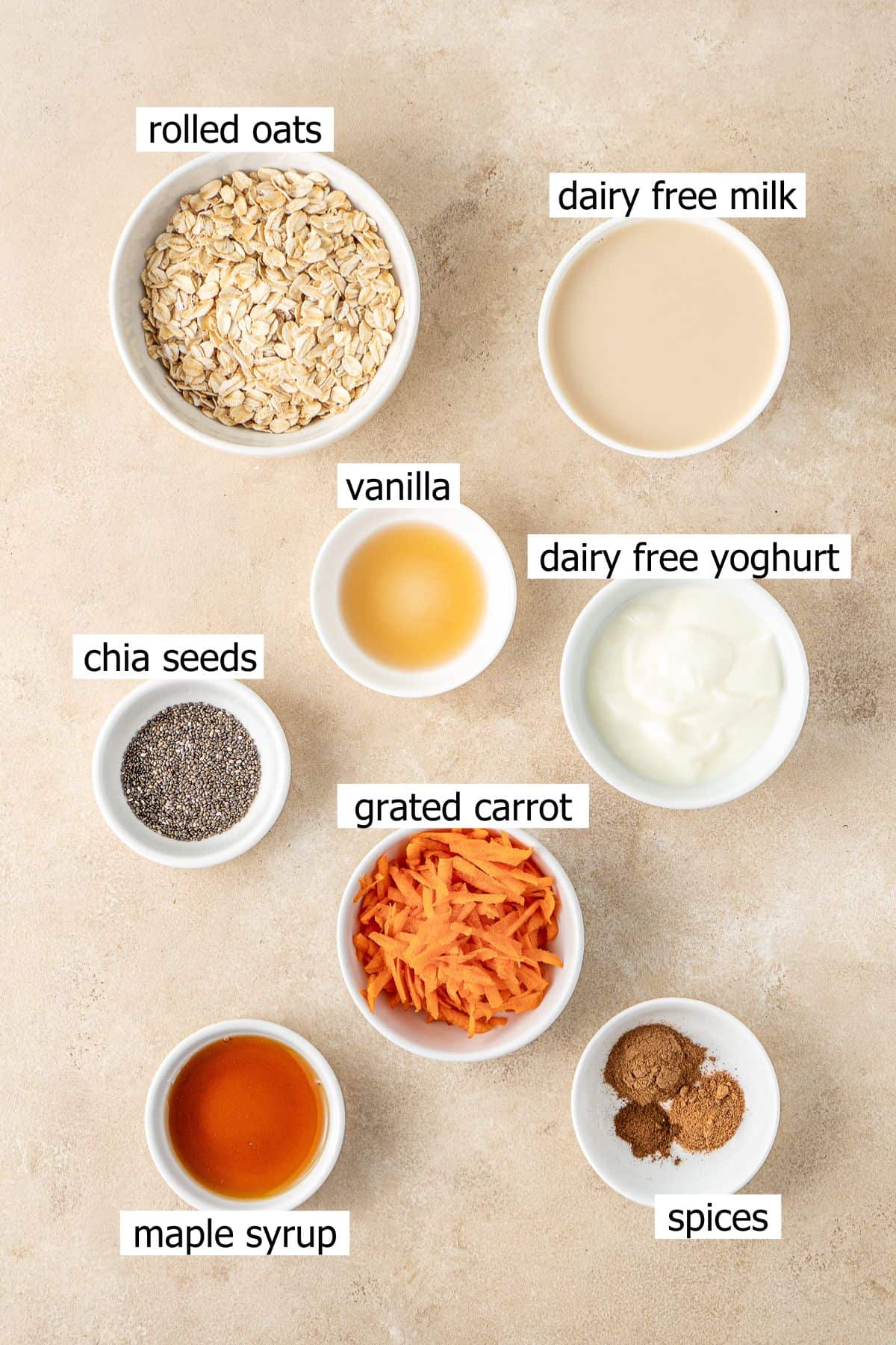 All ingredients needed to make carrot cake overnight oats laid out.