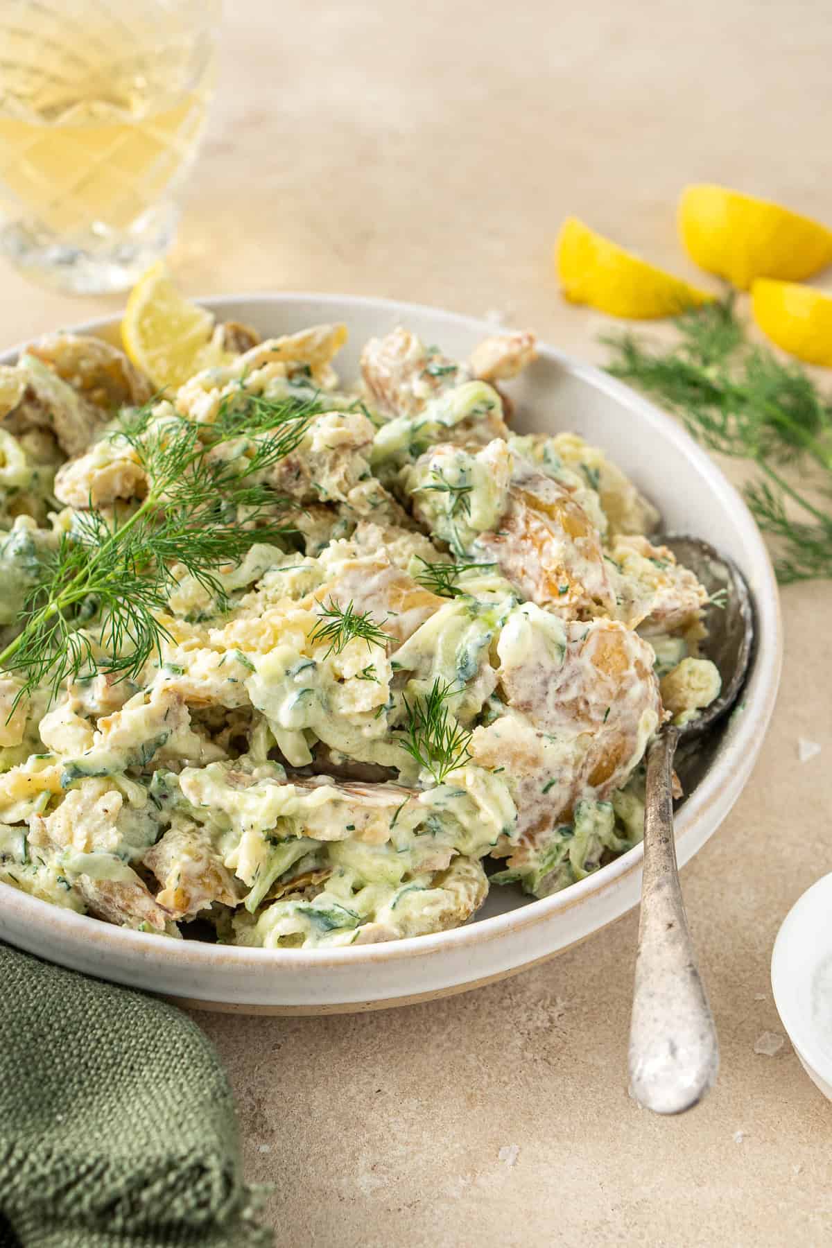 A bowl of smashed potato salad.