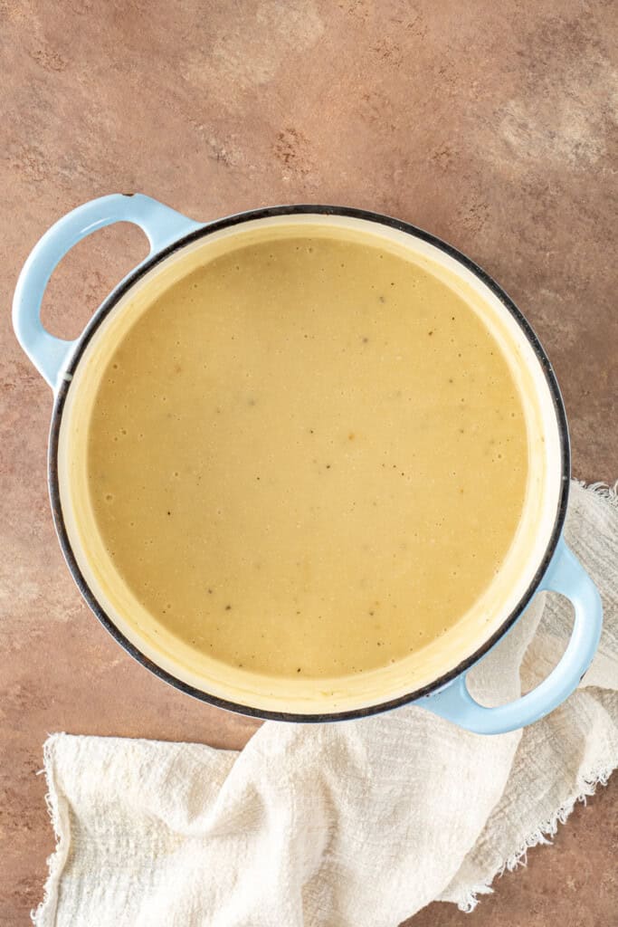 The finished blended potato soup in the pot.