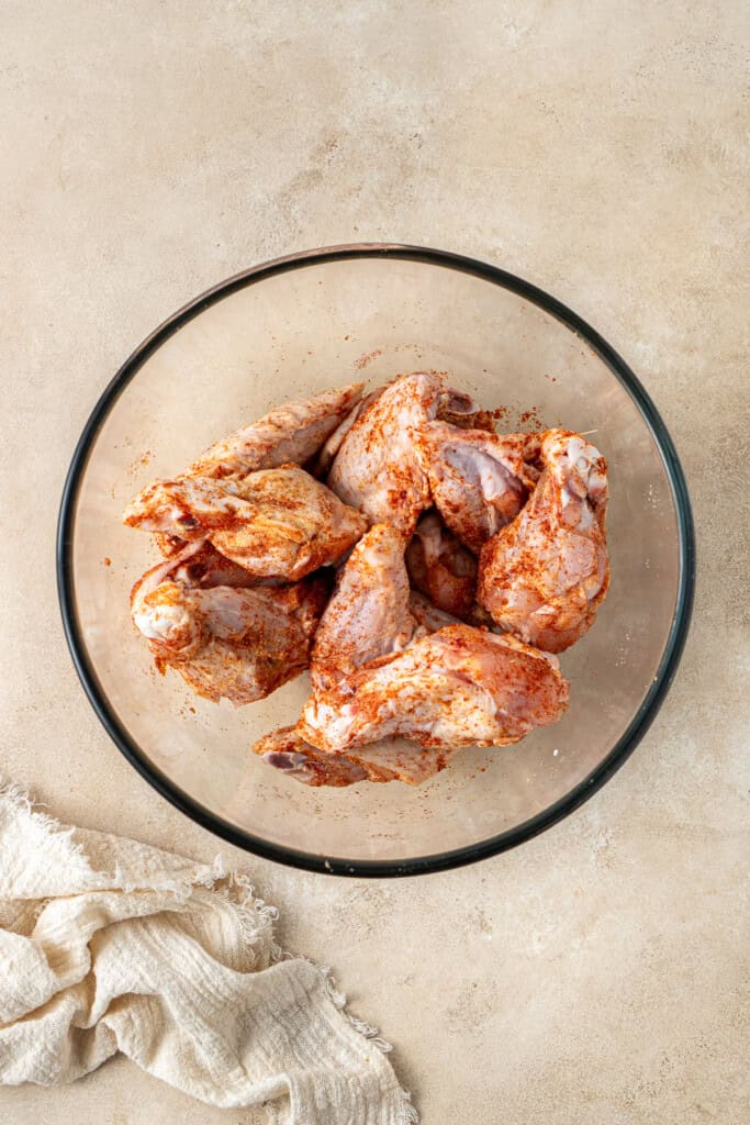 The cut chicken wings in a bowl.