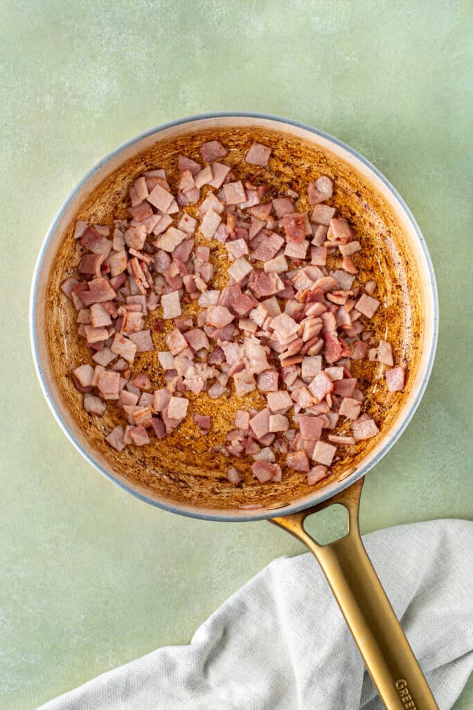 The cooked bacon in the pan.