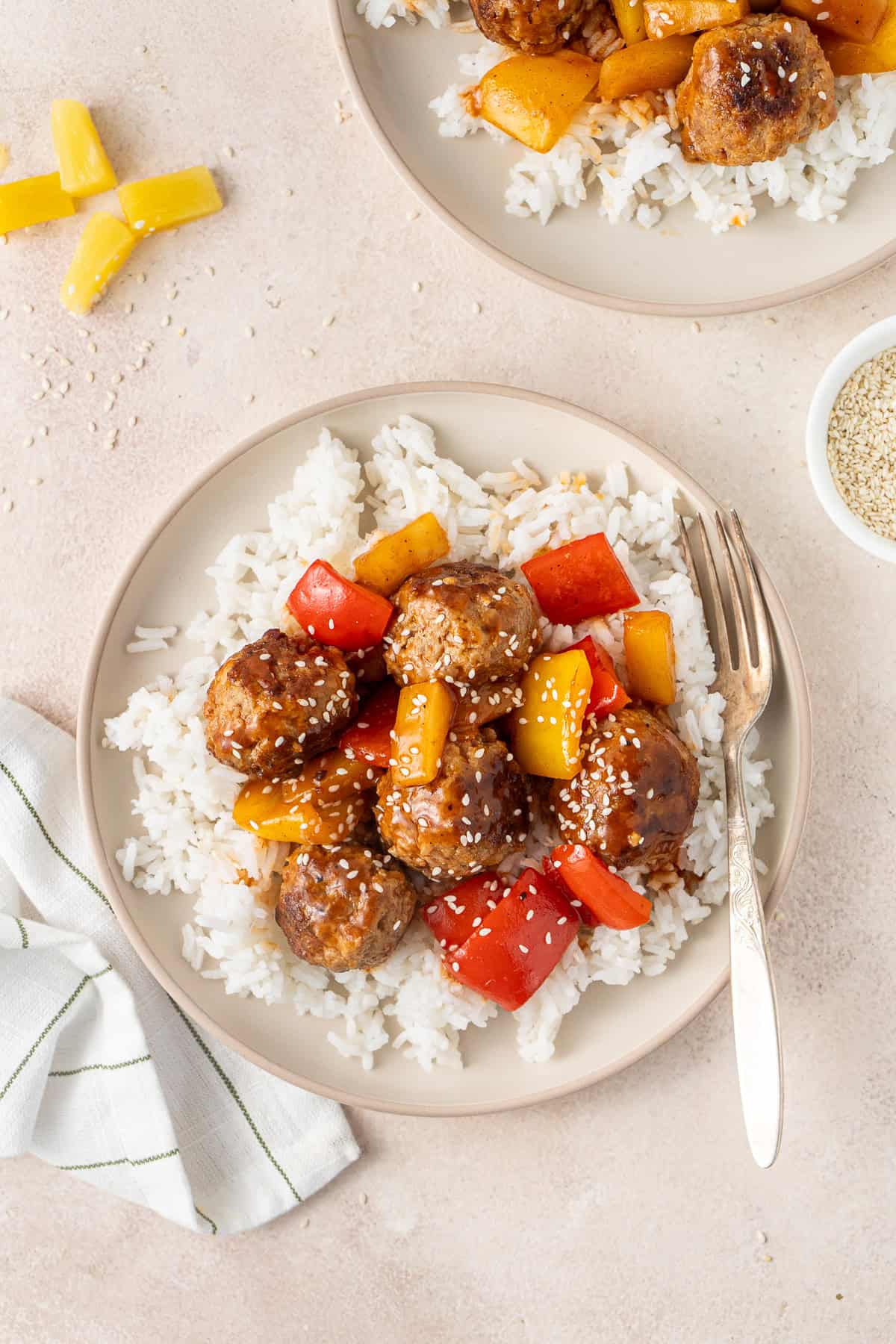 Sweet and sour pork meatballs served over rice.