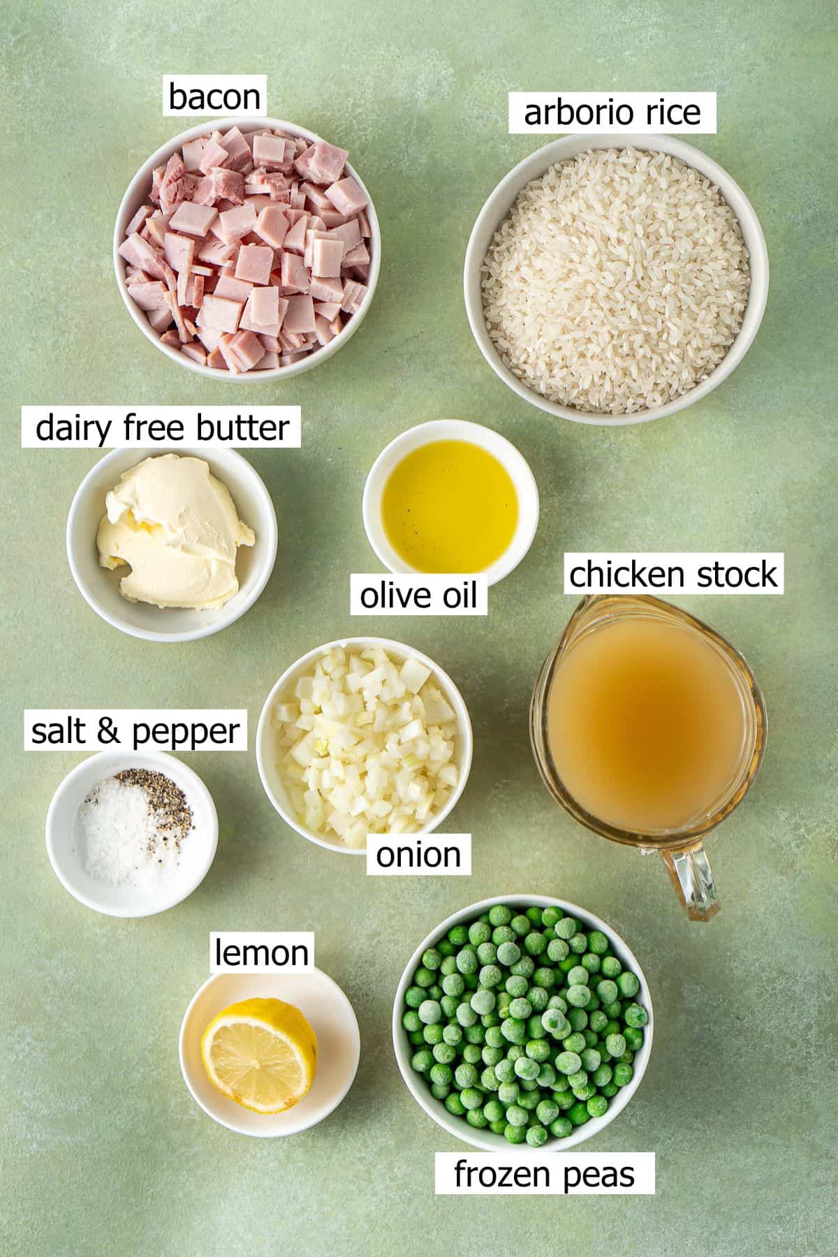 All ingredients needed to make pea and bacon risotto laid out in bowls.