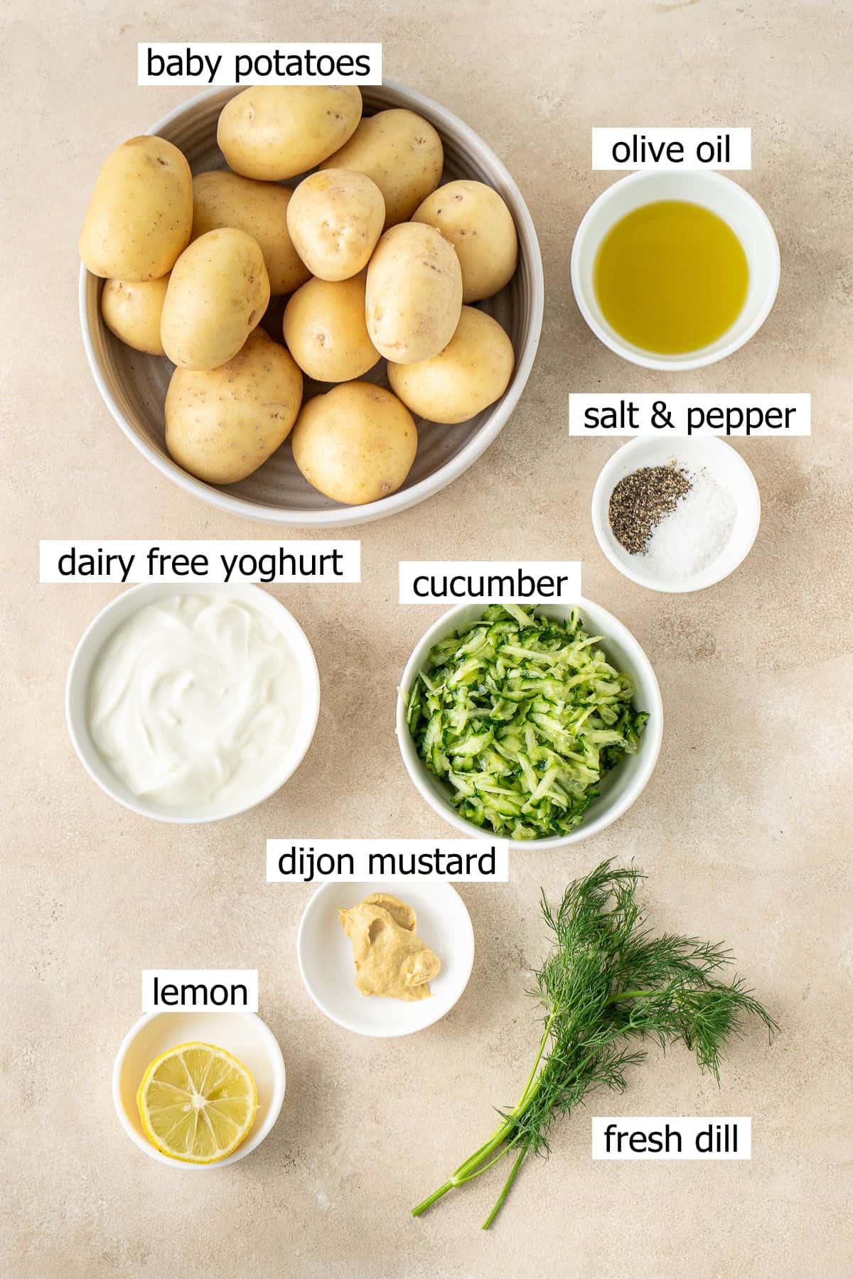 All ingredients needed to make crispy smashed potato salad laid out in bowls.