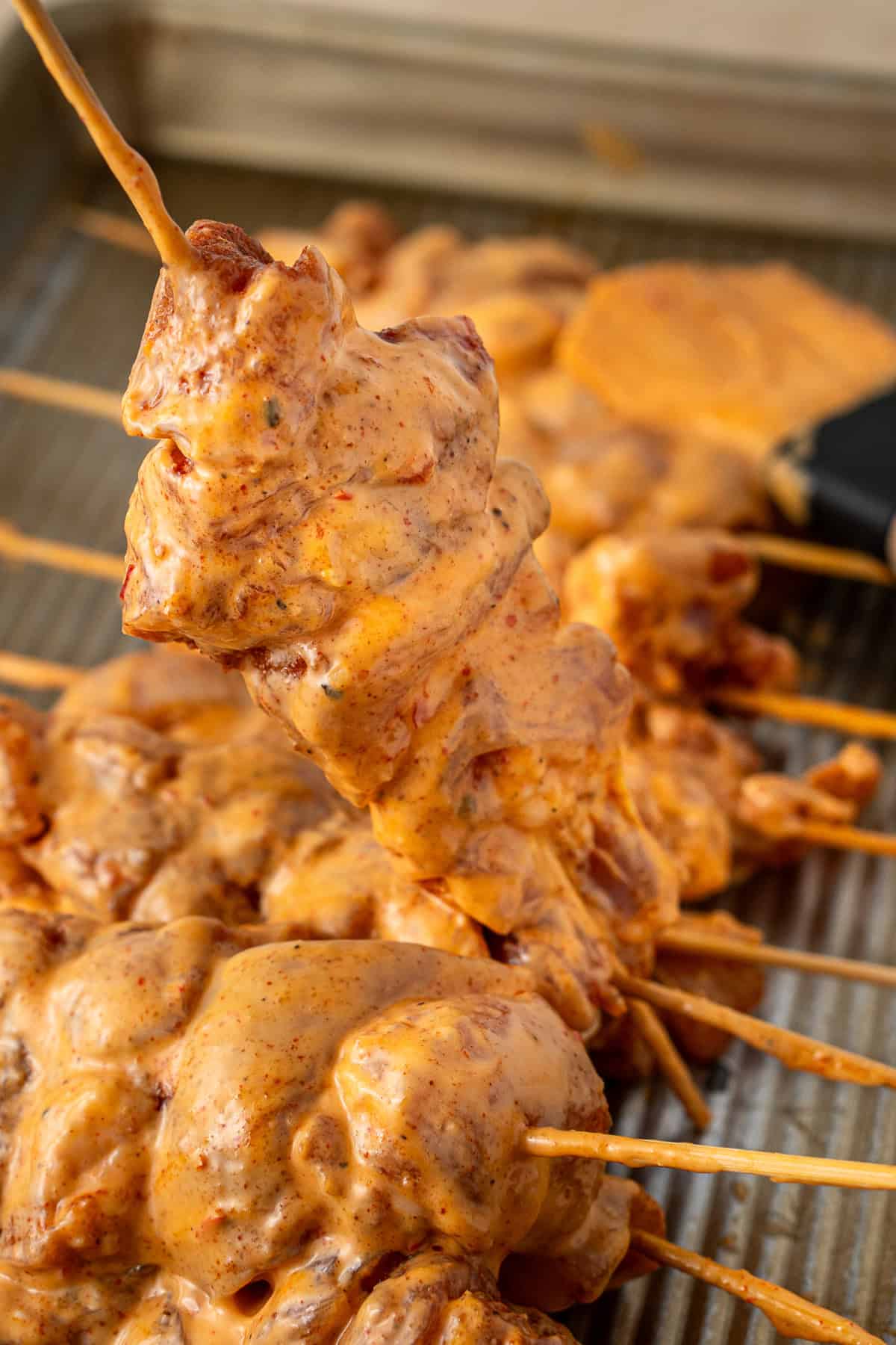 The marinated chicken skewers. 