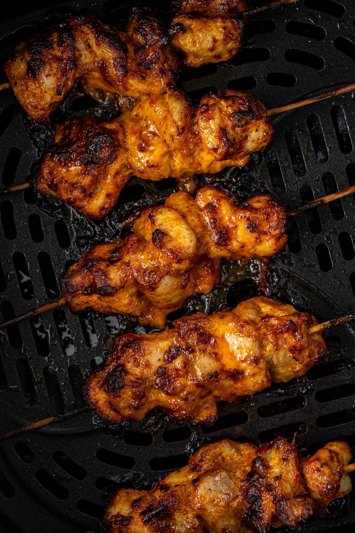 The marinated bang bang chicken skewers in the air fryer.