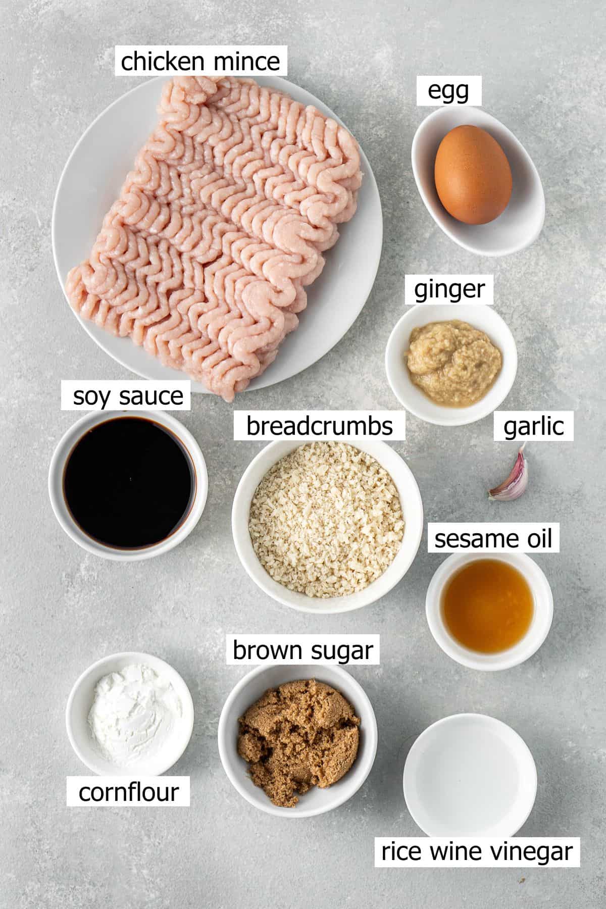All ingredients needed to make chicken teriyaki burgers laid out in small bowls.