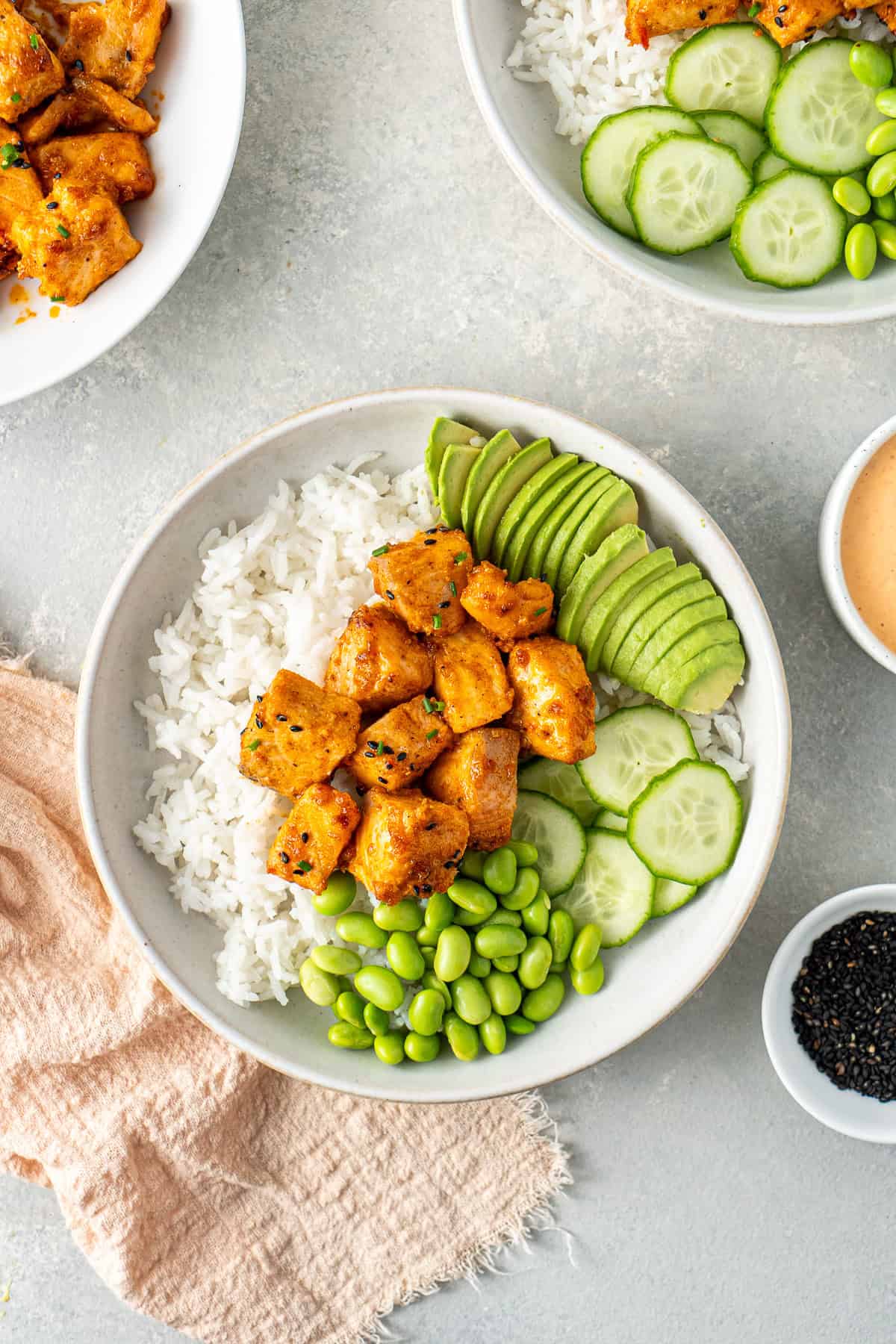 Assembling the bang bang salmon rice bowls.