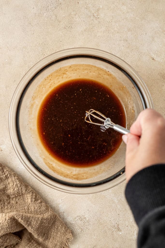 Mixing up the tonkatsu sauce in a small bowl.