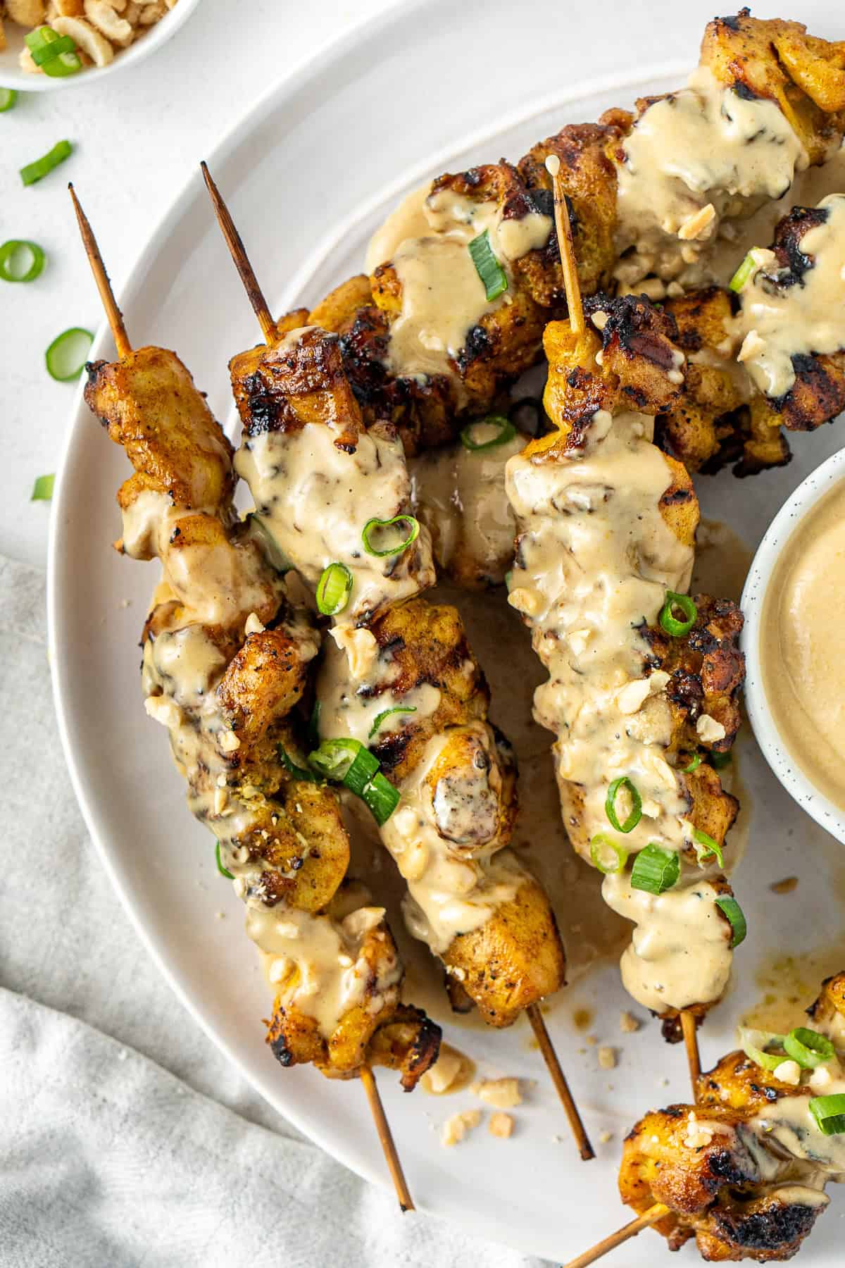 Peanut satay chicken skewers.