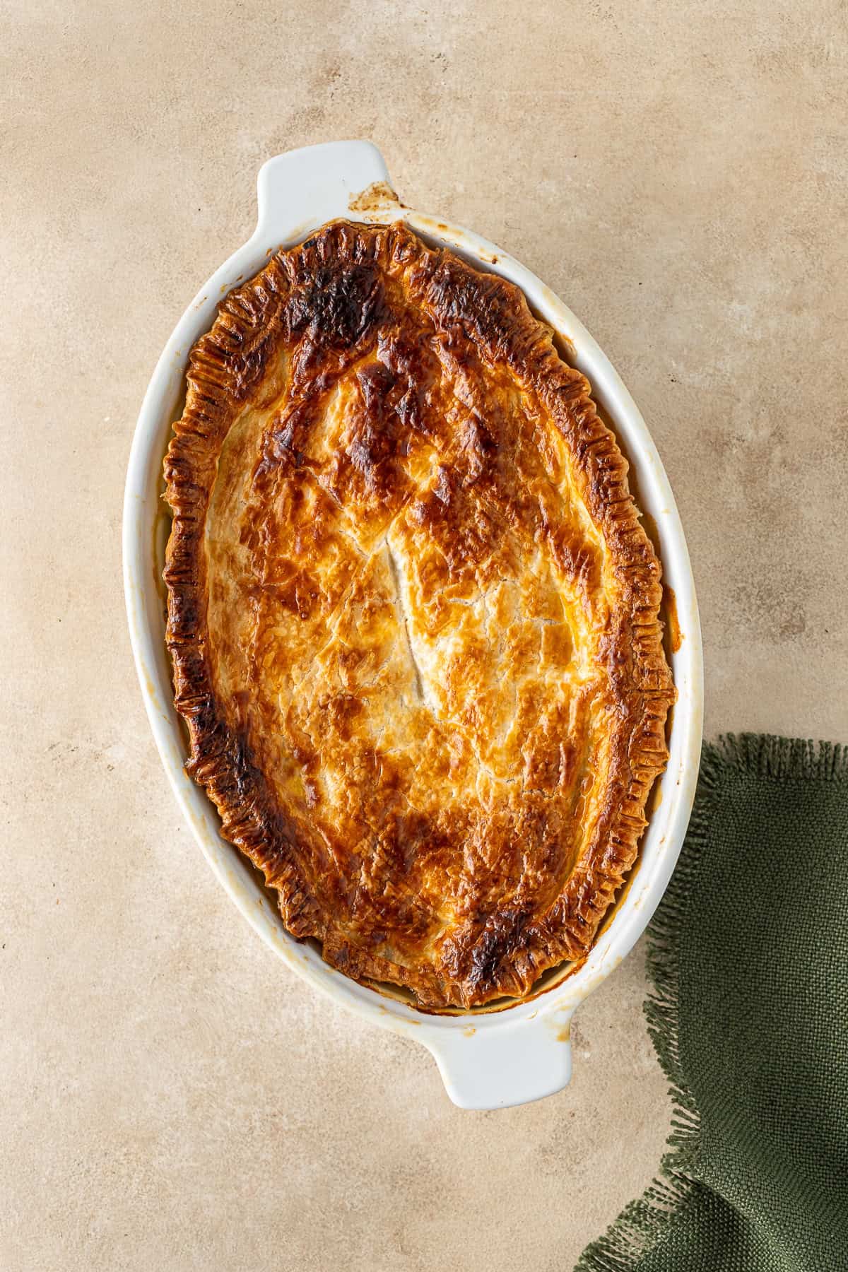 The freshly baked dairy free chicken and leek pie with golden pastry.