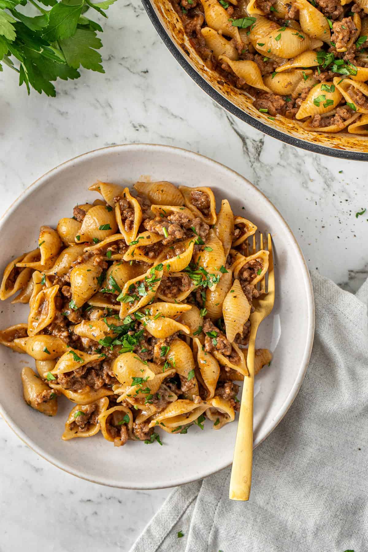 Ground beef pasta served into a bowl with a fork.