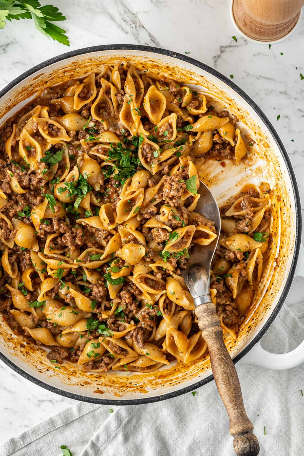 One pot beef mince pasta with a serving spoon.