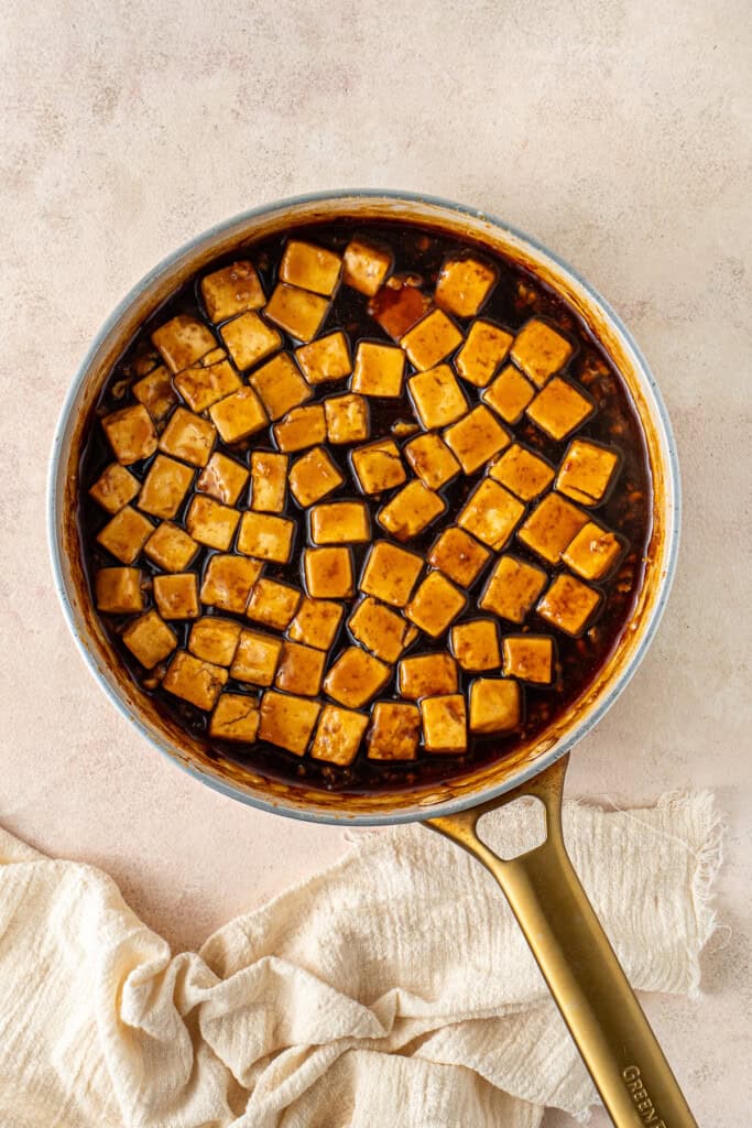 The sauce in the pan with the tofu.