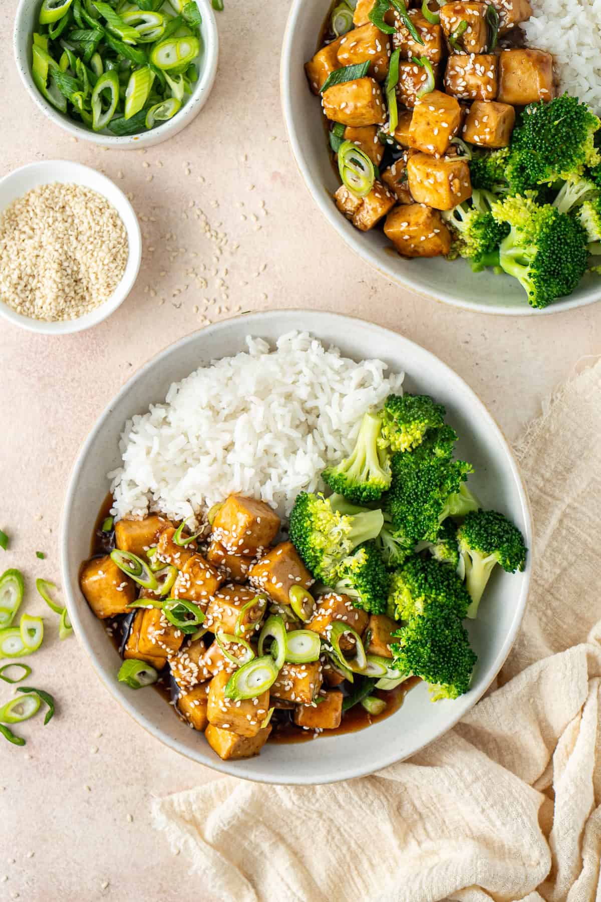 Easy teriyaki tofu served into bowls with rice and broccoli.