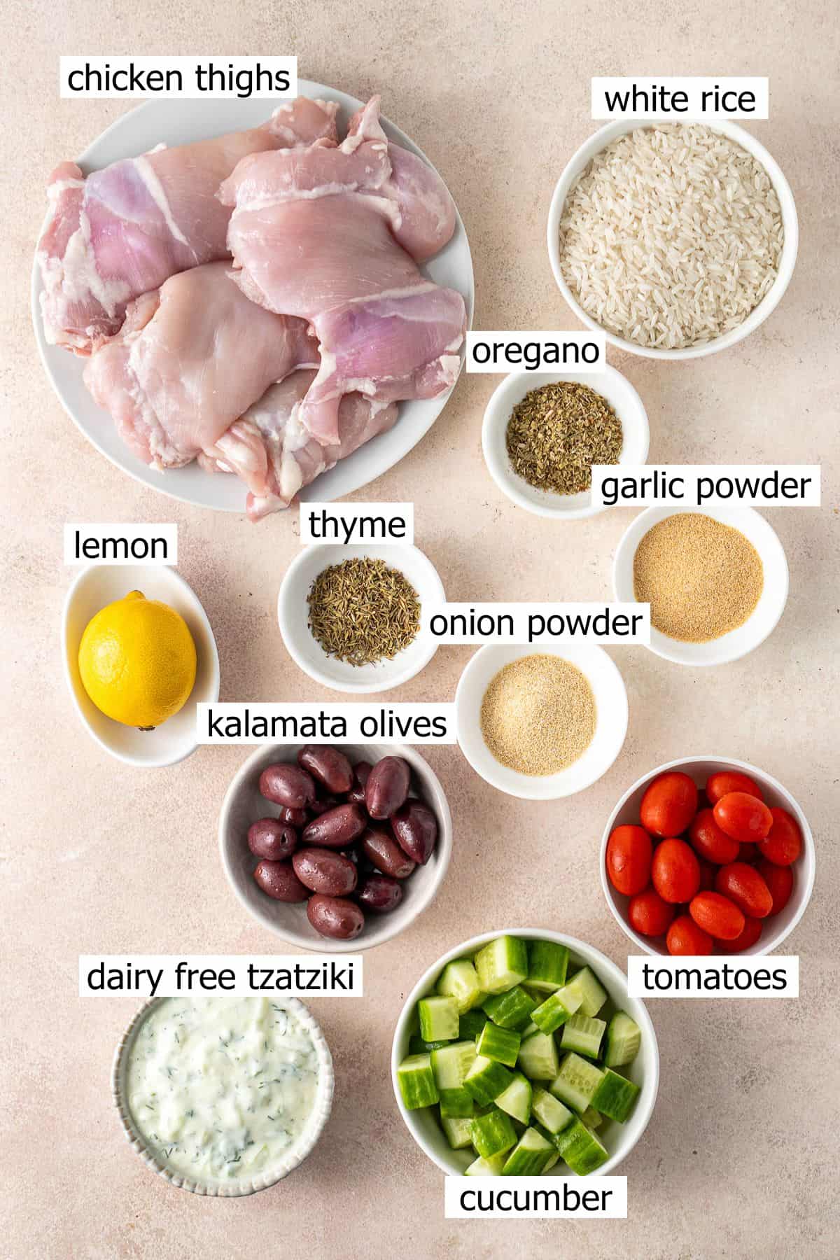 All ingredients needed to make Greek chicken and rice bowls.
