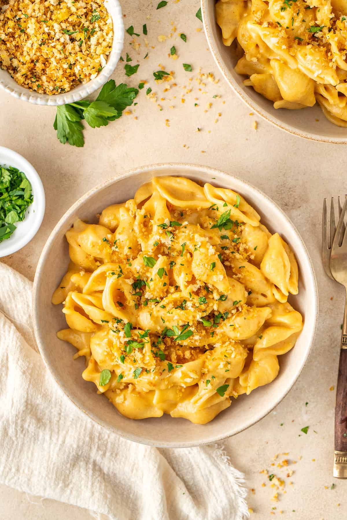 Dairy free mac and cheese in a bowl with crispy breadcrumbs.