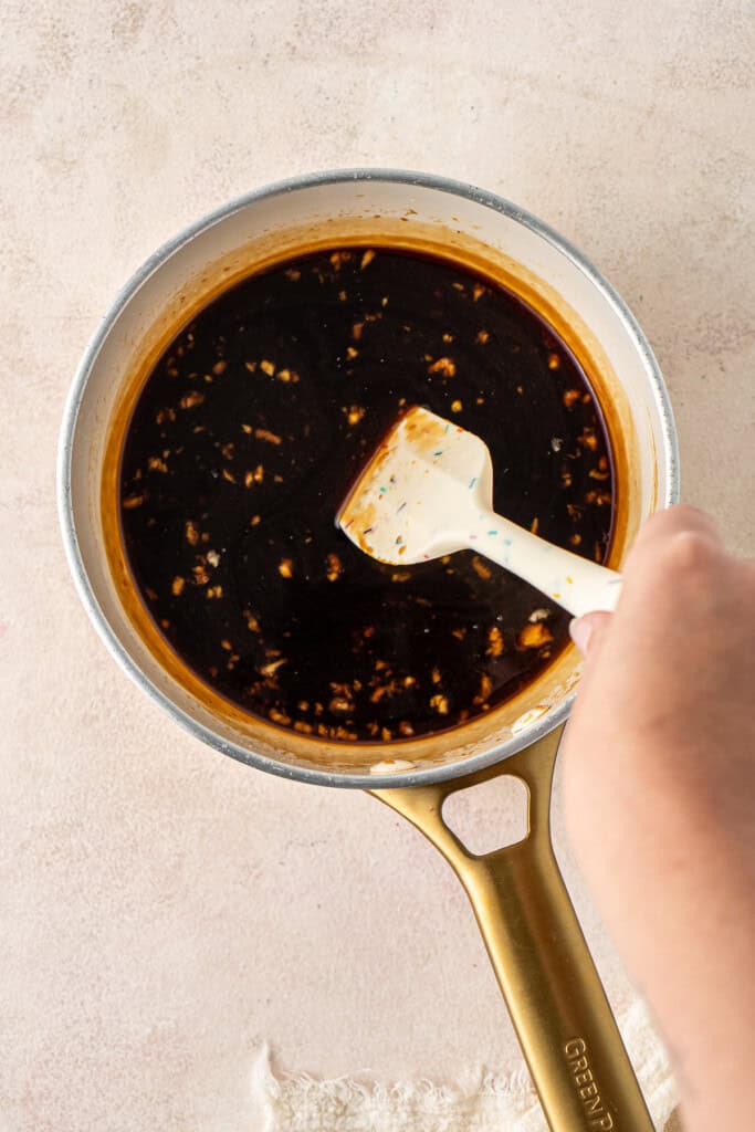 Making the teriyaki sauce in a small saucepan.